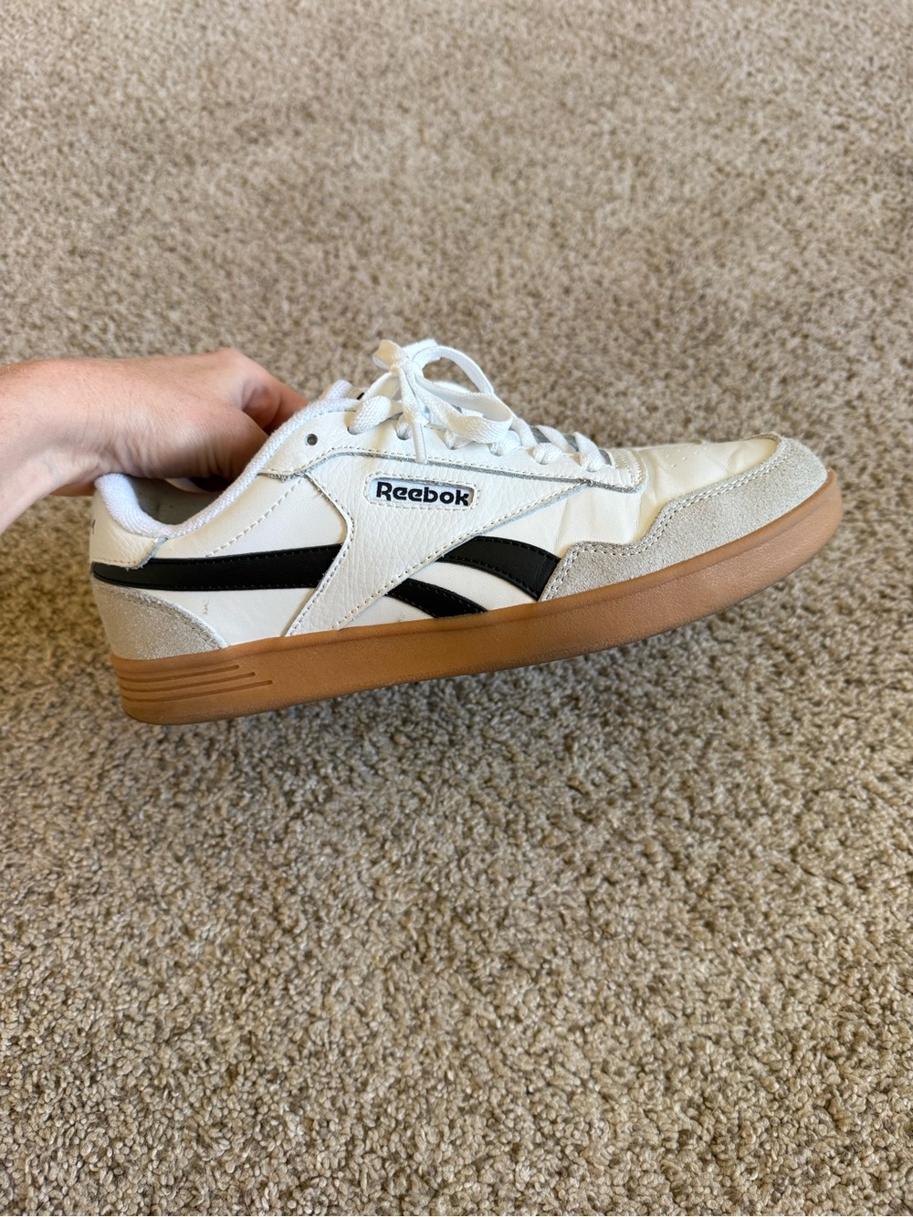 Reebok women’s Classic White & Black Leather Sneakers with Gum Sole